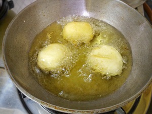 Stuffed Potato in Chilli Garlic Sauce